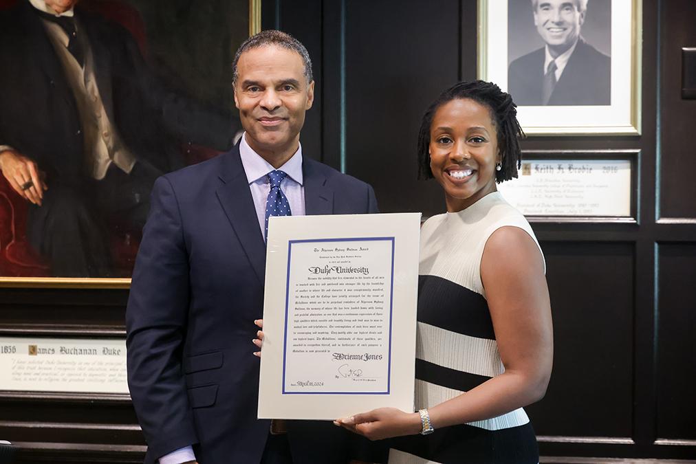 Provost with student holding citation