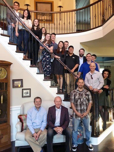 General Martin Dempsey and Prof Peter Feaver seated, with students behind on stairwell